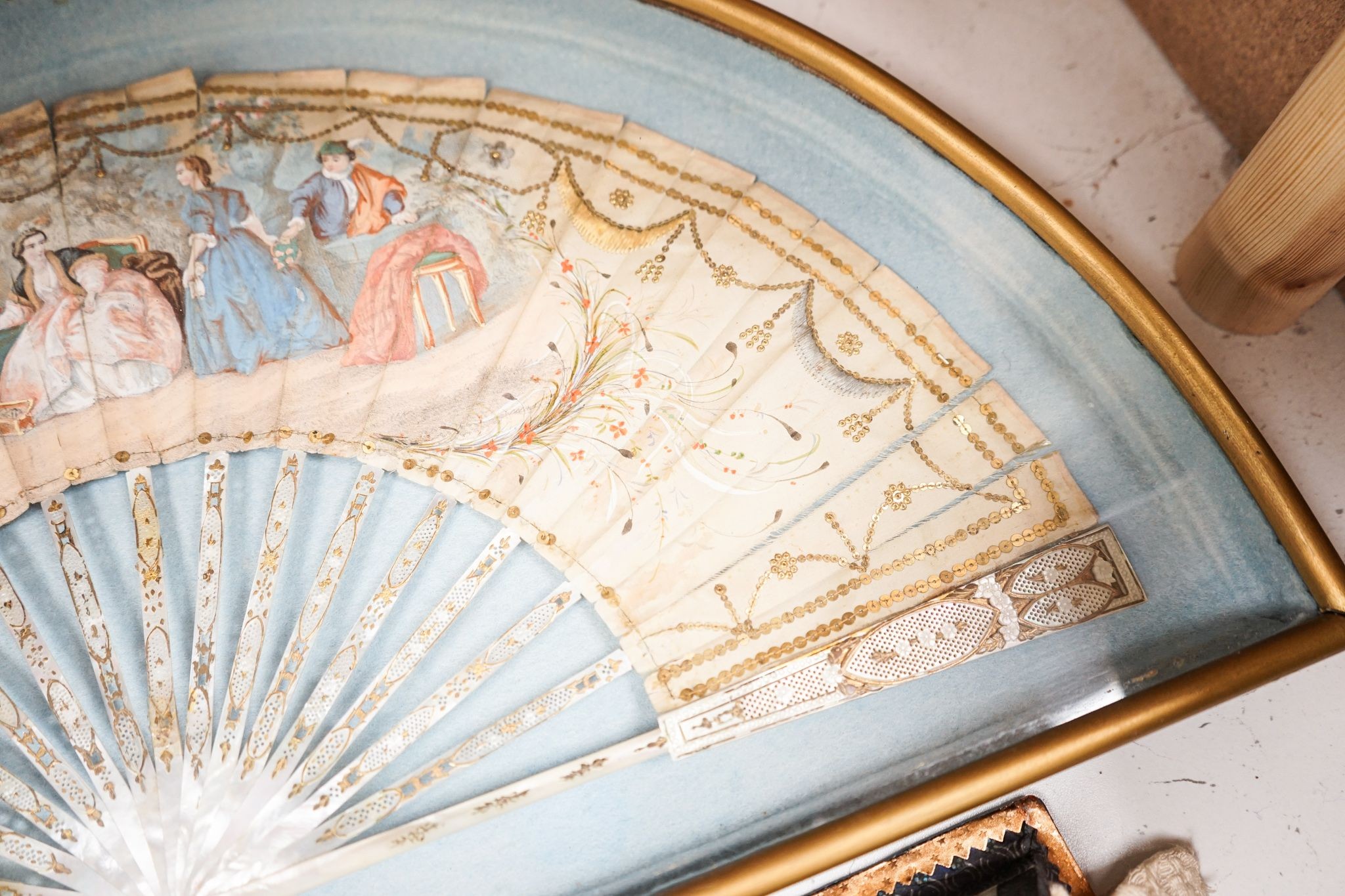 A late 18th / early 19th century Continental figurative framed fan and two religious cased effigy of baby Jesus